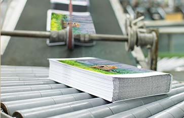 Printed items going down a conveyor belt